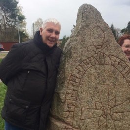 couple by viking Rune stone in Sweden
