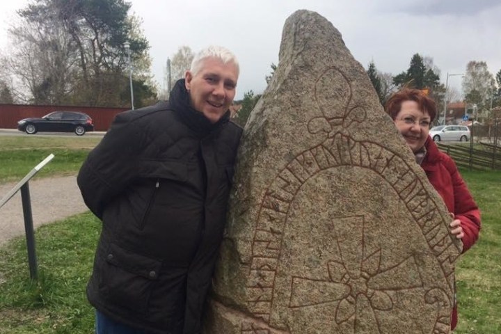 couple by viking Rune stone in Sweden