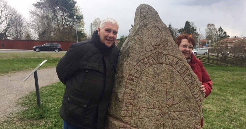 Public Viking History Tour | Full Day Image 1 couple by viking Rune stone in Sweden