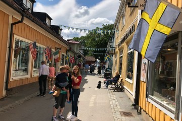 wooden houses Swedish flag Sigtuna city Tour from Stockholm