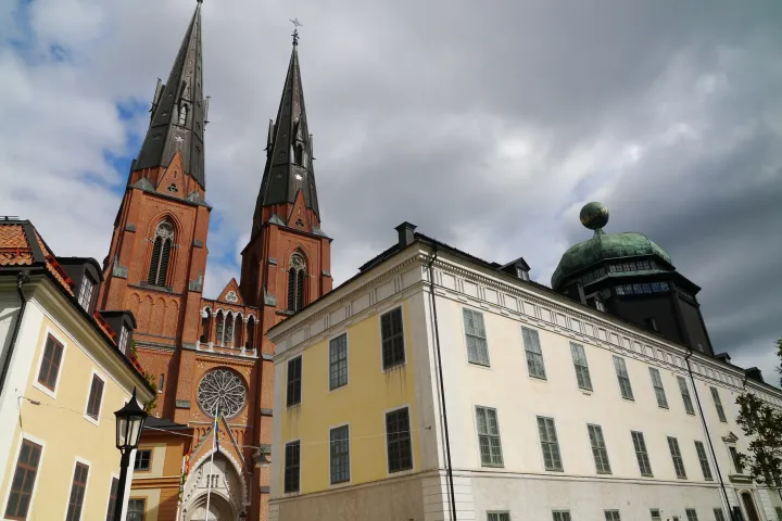 a large clock tower in front of a building