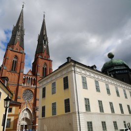 a large clock tower in front of a building