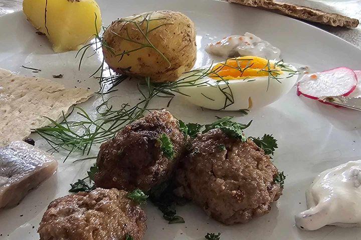 a plate of food with rice meat and vegetables