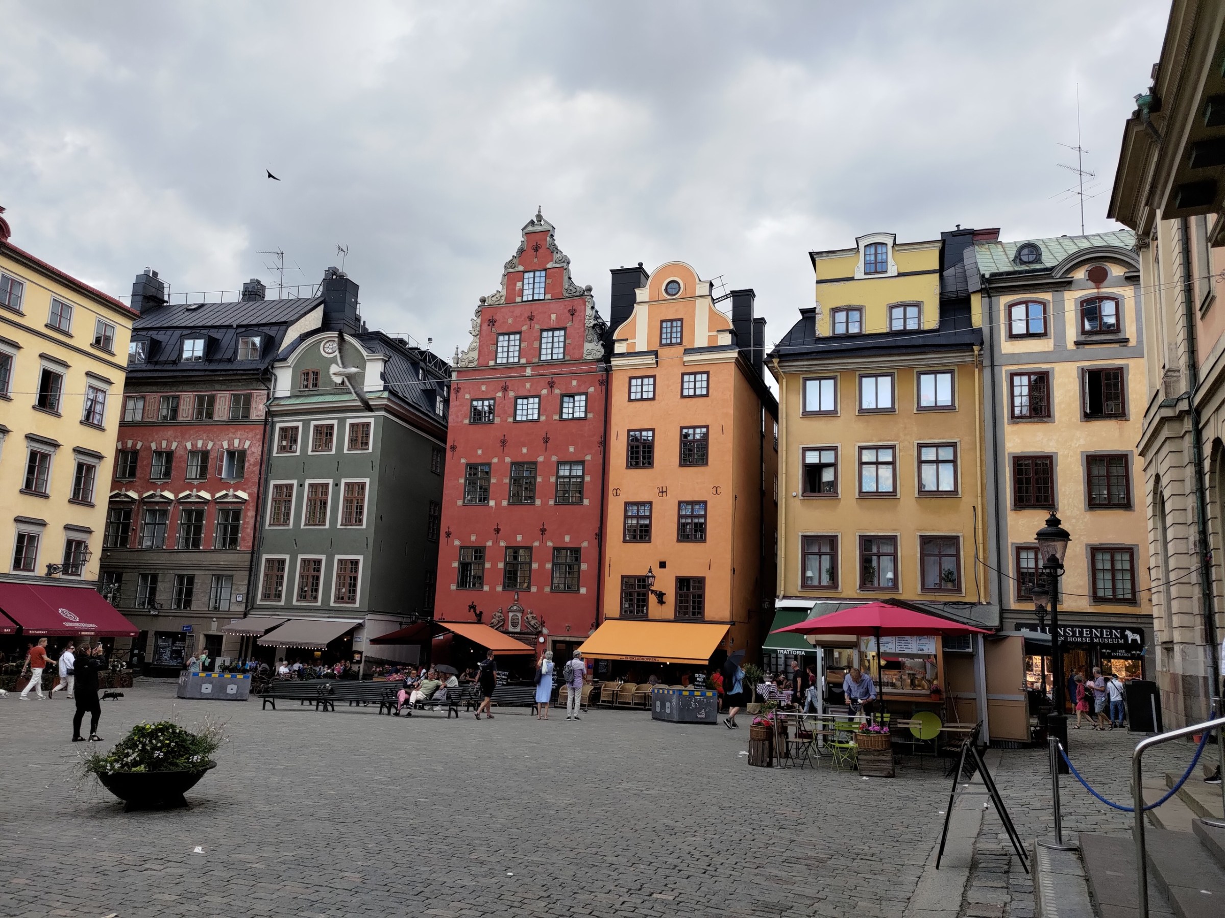 a group of people in front of Gamla stan