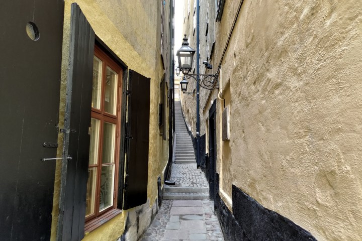 a stone building that has a narrow street