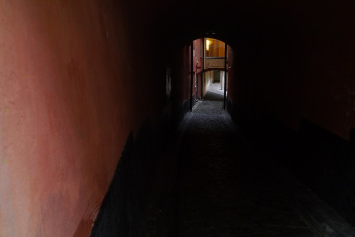 a bed in a dark room