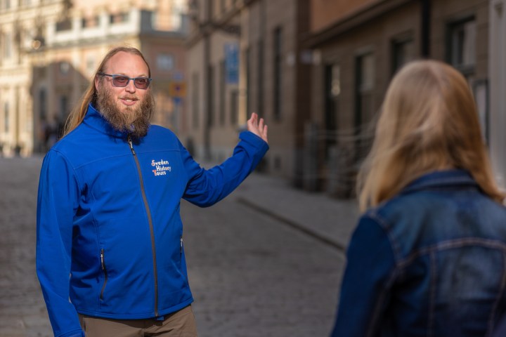 a man standing in front of a building