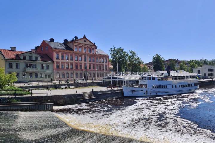 a body of water with a city in the background