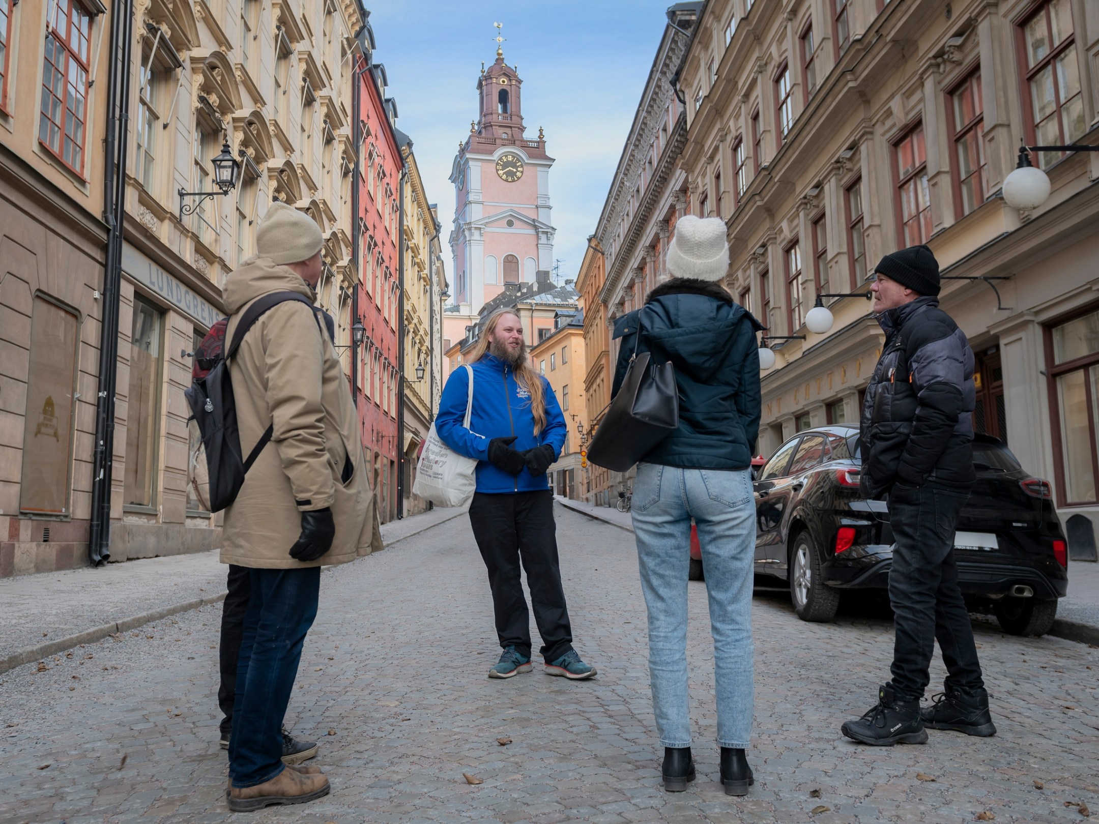 a group of people standing in front of a building