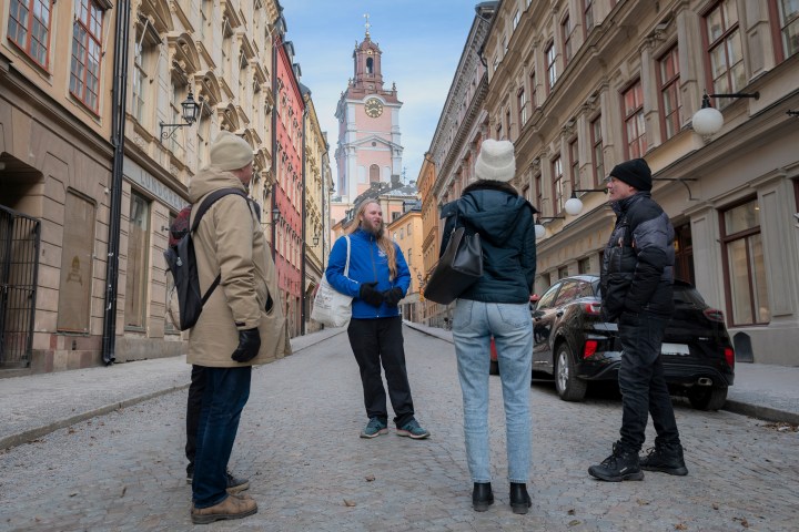 a group of people standing in front of a building