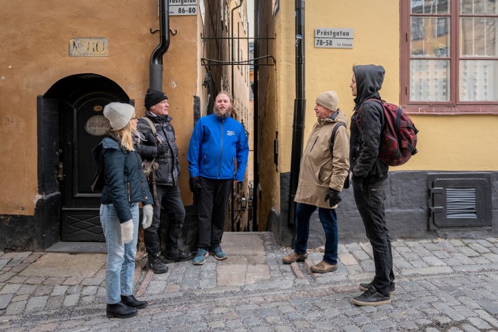 a group of people standing in front of a building