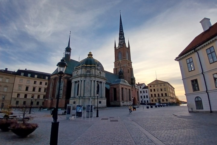 a castle with a clock on the side of Riddarholm Church