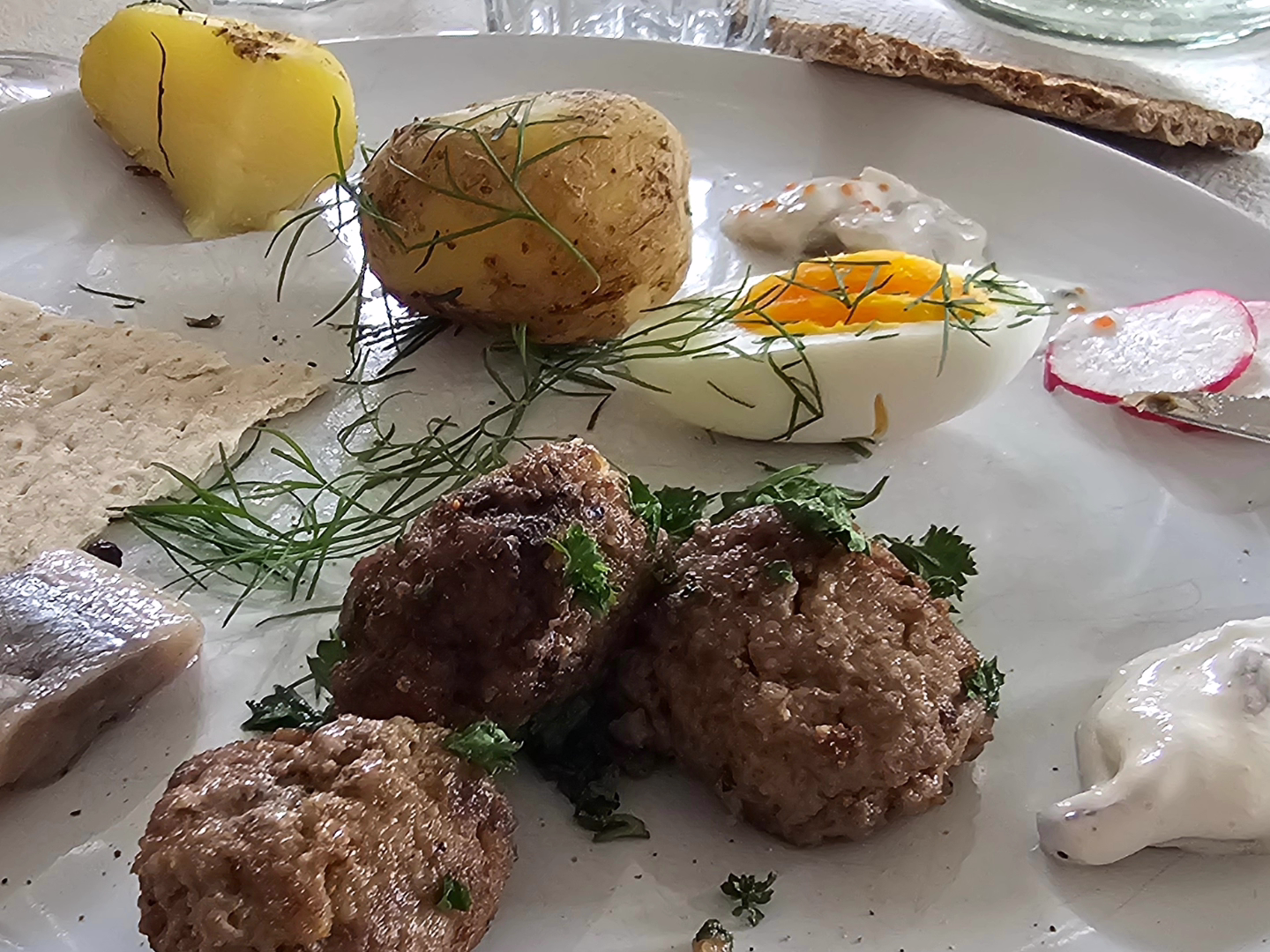 a plate of food with rice meat and vegetables