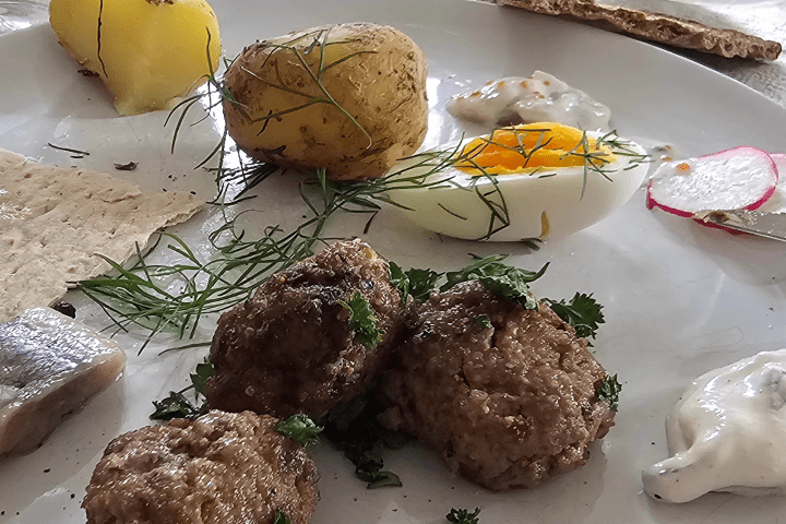 a plate of food with rice meat and vegetables