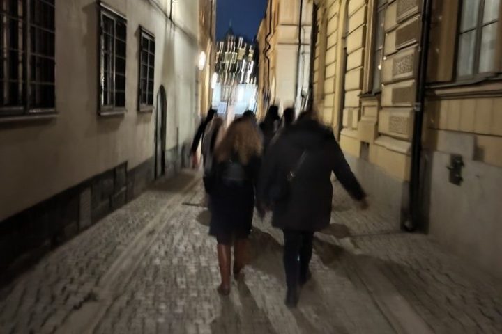 a person walking down a sidewalk