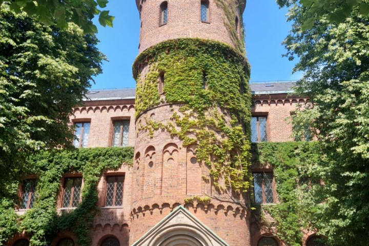 a large brick building with a clock tower