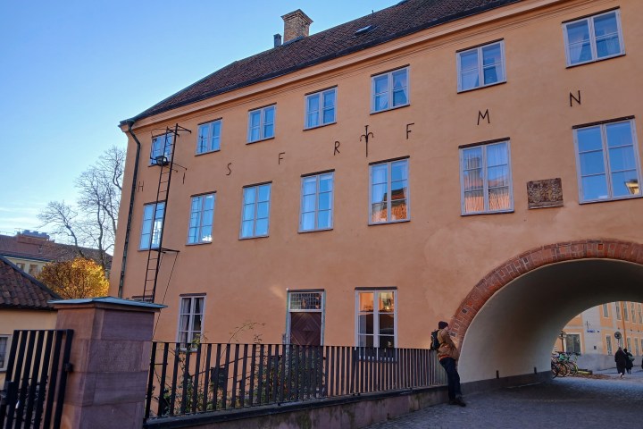 a castle with a clock on the side of a building